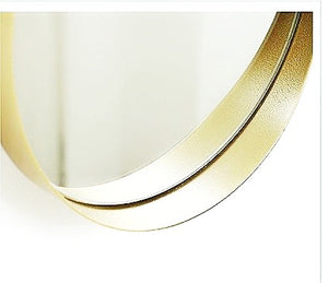 Gold mirror with chain strap.